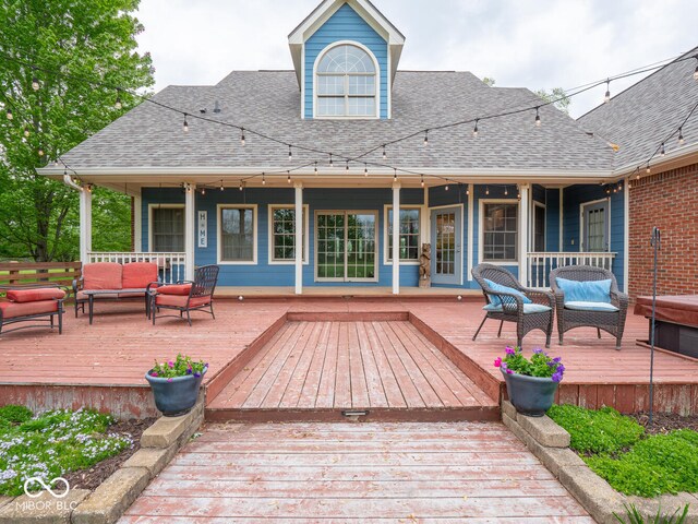 wooden deck with an outdoor living space