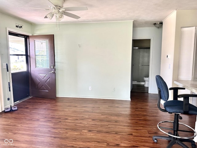 dining space with baseboards, wood finished floors, a ceiling fan, and a textured ceiling