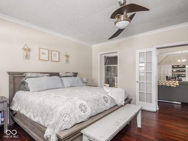bedroom featuring ornamental molding, a textured ceiling, ceiling fan with notable chandelier, and hardwood / wood-style floors