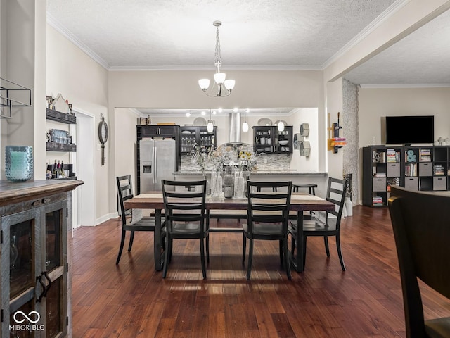 dining room featuring an inviting chandelier, ornamental molding, and dark wood-style flooring