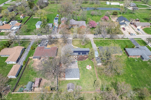 birds eye view of property with a residential view and a water view