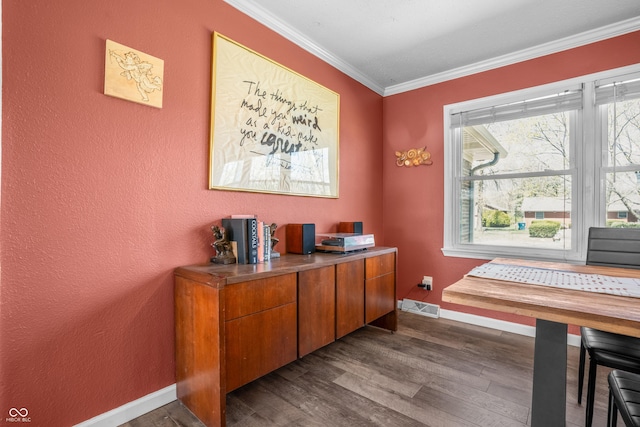 office with visible vents, baseboards, ornamental molding, and dark wood finished floors