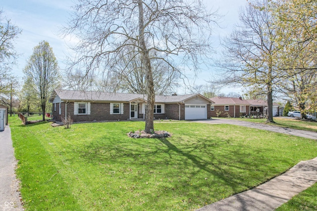 ranch-style home with brick siding, driveway, a front lawn, and a garage