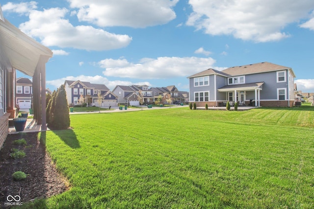 view of yard with a patio area and a residential view