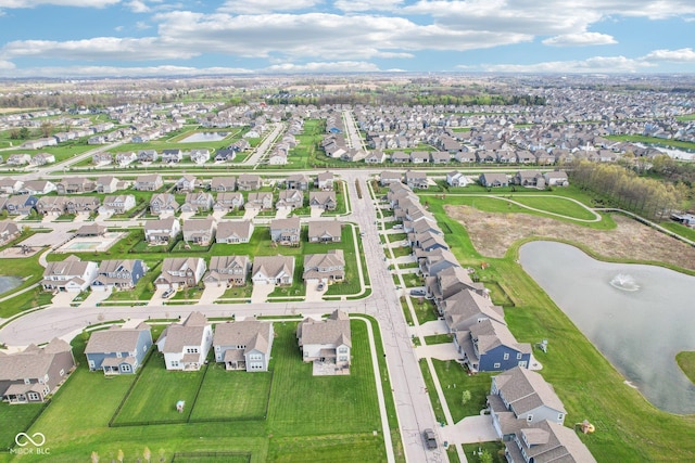 birds eye view of property featuring a residential view and a water view