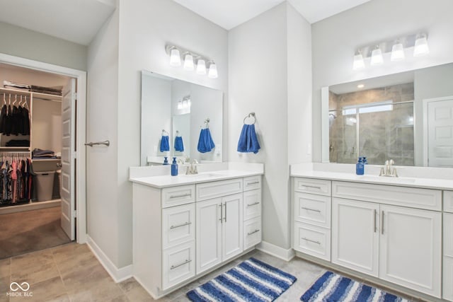 bathroom featuring two vanities, a sink, and a shower stall