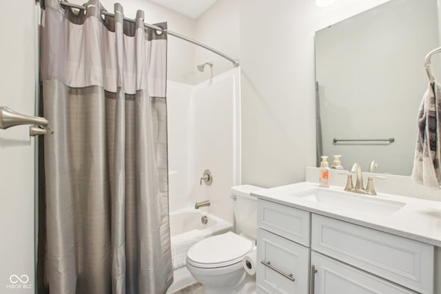 bathroom featuring shower / tub combo, vanity, and toilet