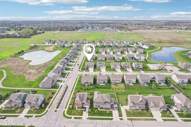 aerial view featuring a water view and a residential view