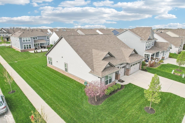 birds eye view of property with a residential view