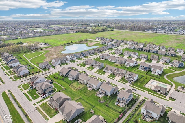 birds eye view of property featuring a residential view and a water view