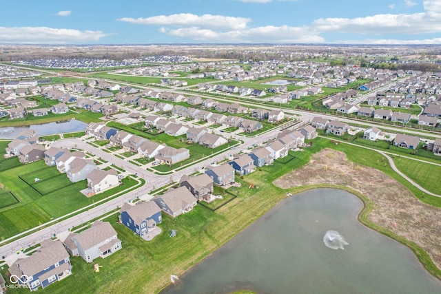 bird's eye view featuring a residential view and a water view