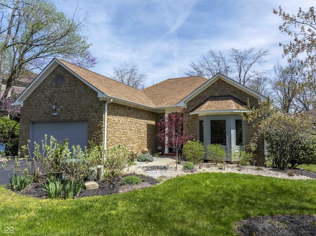 single story home featuring aphalt driveway, stone siding, roof with shingles, a front yard, and a garage