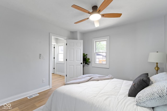 2005 Carrollton Ave, Indianapolis, IN 46202 - bedroom featuring light wood-style flooring, baseboards, and a ceiling fan