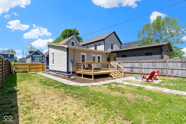 2005 Carrollton Ave, Indianapolis, IN 46202 - rear view of house featuring a wooden deck and a fire pit