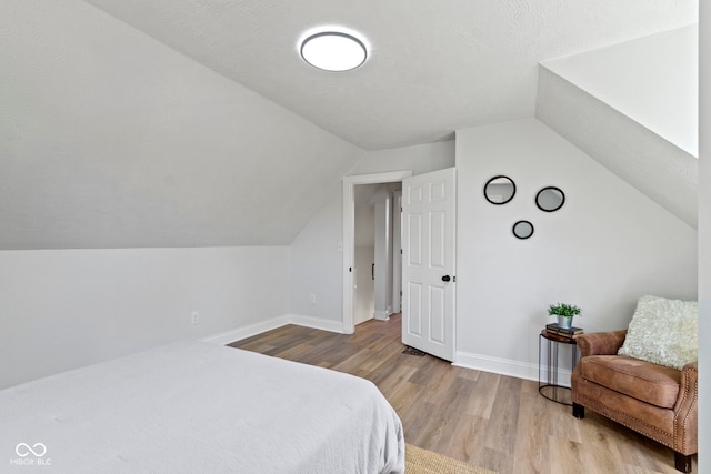 2005 Carrollton Ave, Indianapolis, IN 46202 - bedroom featuring wood finished floors, vaulted ceiling, and baseboards