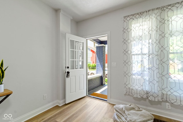 2005 Carrollton Ave, Indianapolis, IN 46202 - entryway featuring light wood-type flooring and baseboards