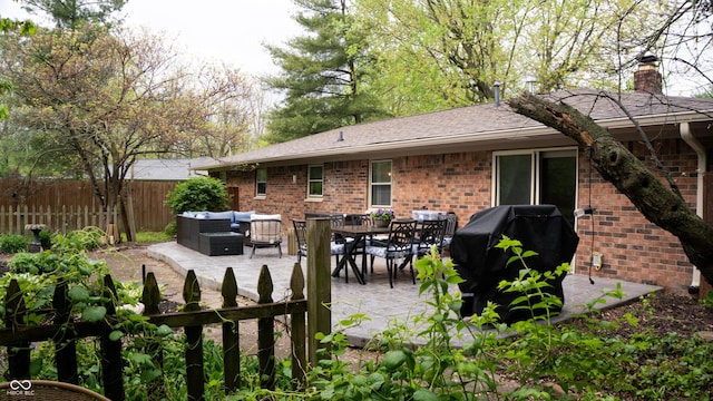 view of patio / terrace with fence and an outdoor hangout area
