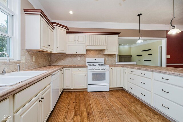 6345 Canak Dr, Avon, IN 46123 - kitchen featuring white appliances, crown molding, a sink, pendant lighting, and light countertops
