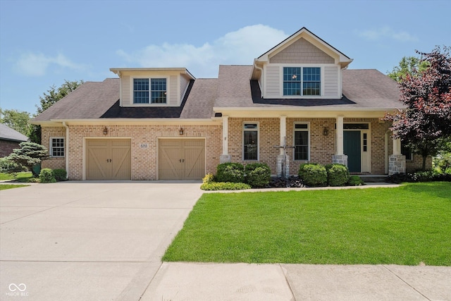 6345 Canak Dr, Avon, IN 46123 - craftsman-style house featuring concrete driveway, a front yard, an attached garage, and brick siding