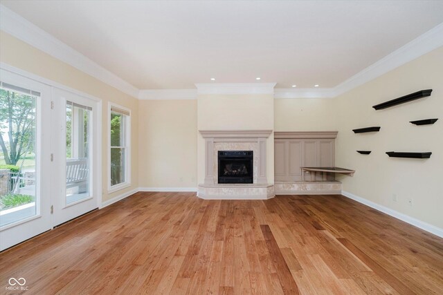 6345 Canak Dr, Avon, IN 46123 - unfurnished living room with light wood-type flooring, ornamental molding, a premium fireplace, baseboards, and recessed lighting