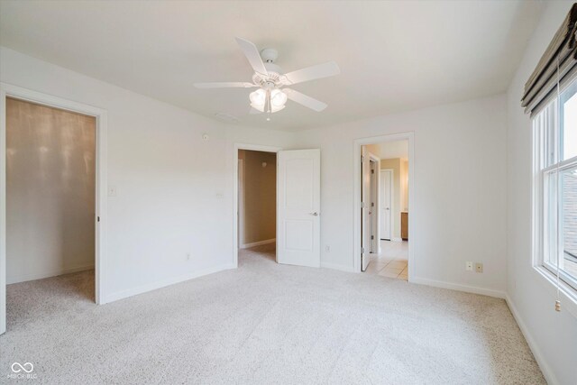 6345 Canak Dr, Avon, IN 46123 - unfurnished bedroom featuring light carpet, multiple windows, baseboards, and ceiling fan