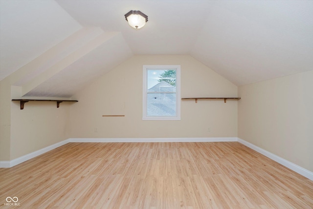 6345 Canak Dr, Avon, IN 46123 - additional living space featuring wood finished floors, baseboards, and vaulted ceiling