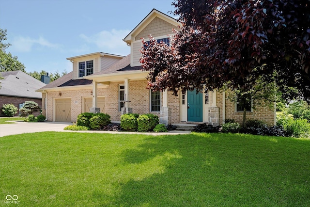 6345 Canak Dr, Avon, IN 46123 - view of front of property with a front lawn, driveway, brick siding, and a garage
