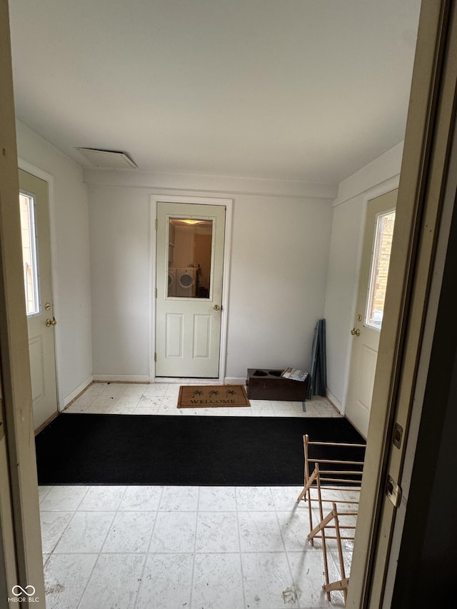 unfurnished room featuring baseboards