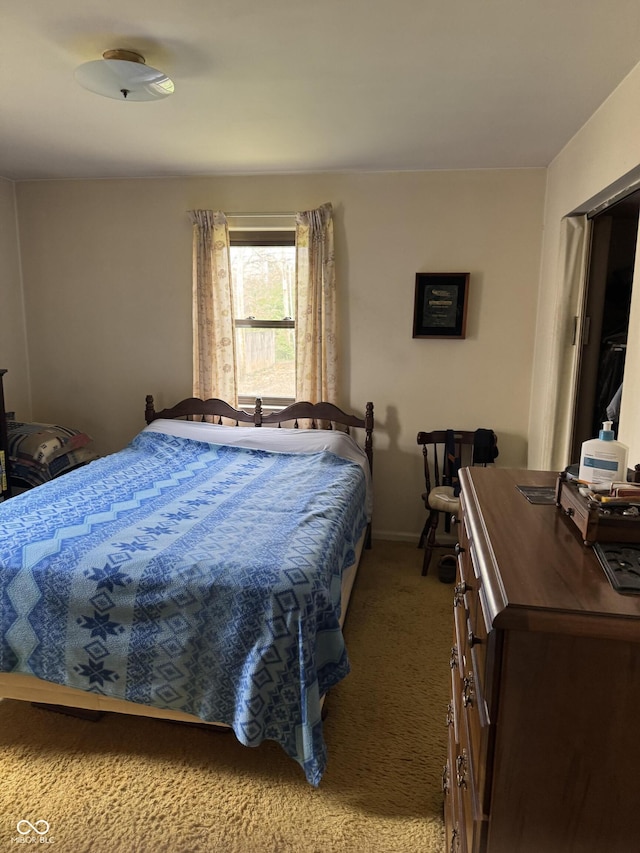 carpeted bedroom with baseboards