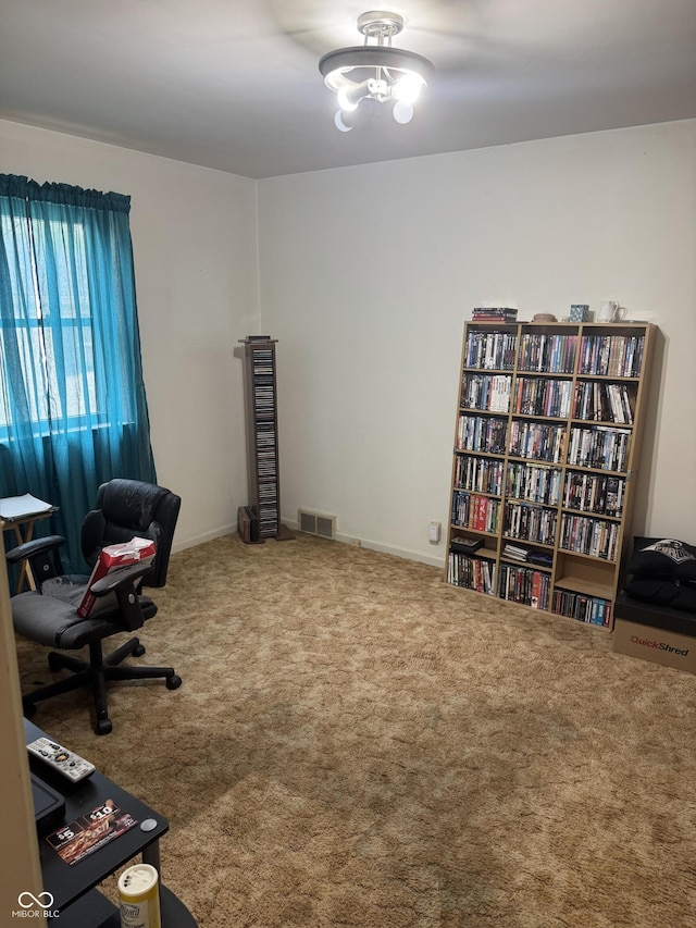 office space featuring visible vents and carpet flooring