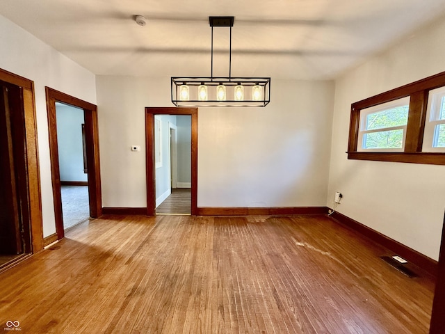 11 Highland St, Greencastle, IN 46135 - unfurnished dining area featuring wood finished floors and baseboards