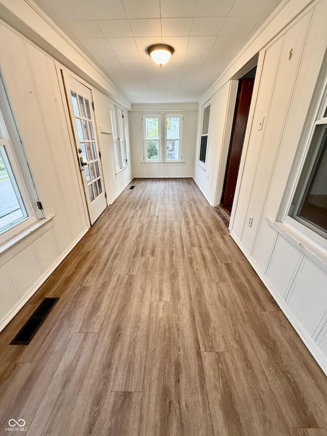 11 Highland St, Greencastle, IN 46135 - interior space with visible vents, wood finished floors, and a decorative wall
