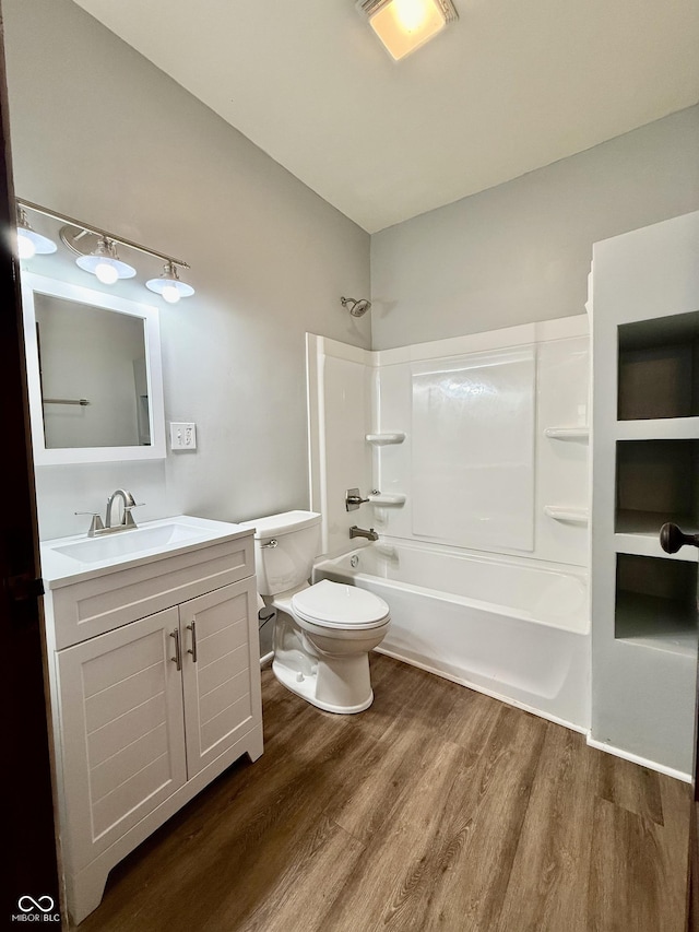 11 Highland St, Greencastle, IN 46135 - full bathroom featuring toilet, vanity, bathtub / shower combination, and wood finished floors