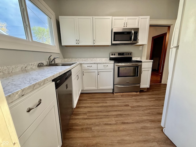 11 Highland St, Greencastle, IN 46135 - kitchen with white cabinetry, stainless steel appliances, and a sink