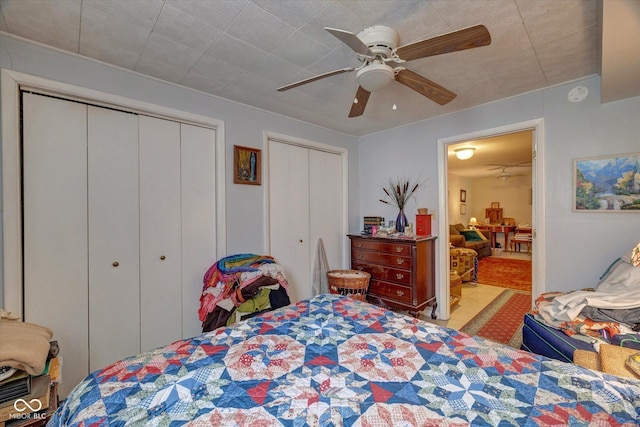 8899 E Southshore Dr, Unionville, IN 47468 - bedroom with two closets and a ceiling fan