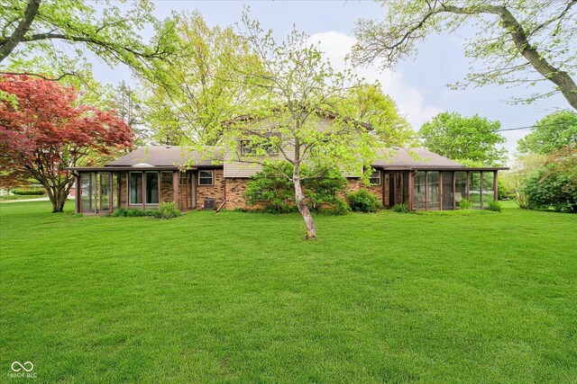 view of yard featuring a sunroom