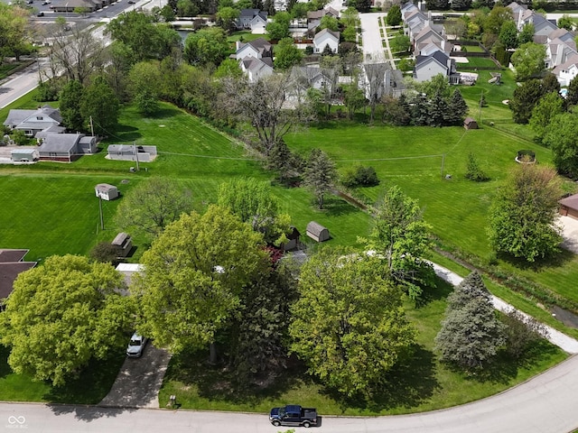 birds eye view of property with a residential view