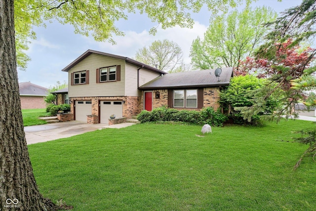 tri-level home with an attached garage, brick siding, driveway, and a front lawn