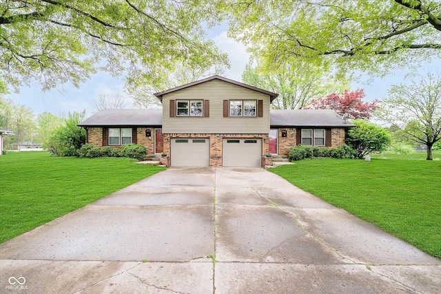 tri-level home with an attached garage, brick siding, driveway, and a front lawn