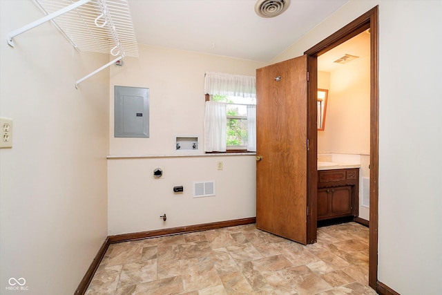 clothes washing area with hookup for a washing machine, visible vents, electric panel, and electric dryer hookup