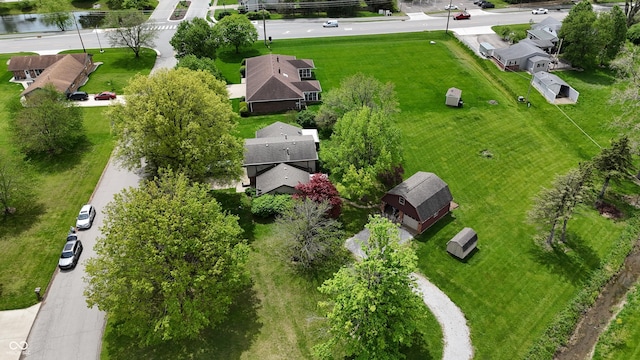 bird's eye view with a water view and a residential view