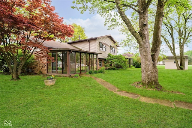 view of yard featuring a sunroom