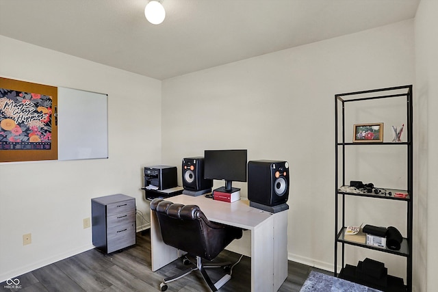 office space with baseboards and dark wood-type flooring