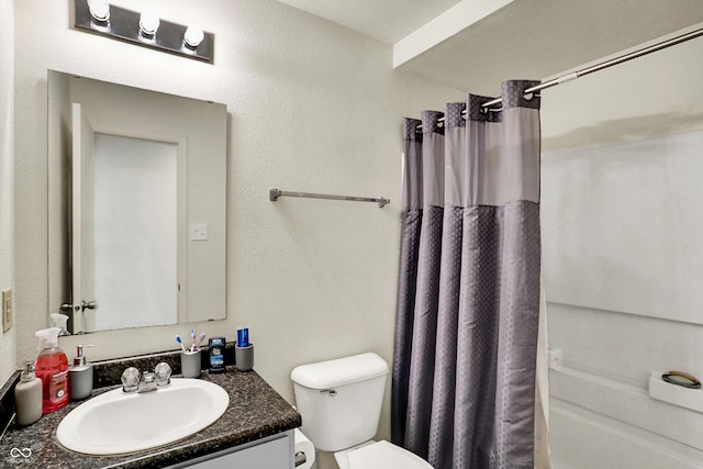 full bathroom with shower / bath combo with shower curtain, toilet, and vanity