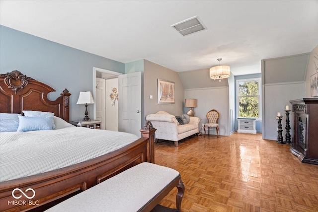 bedroom with baseboards and visible vents