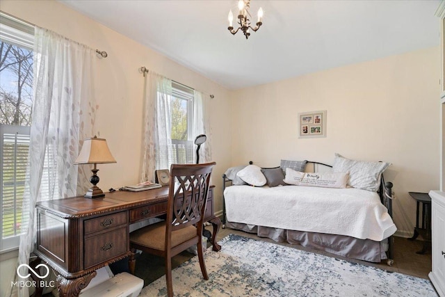bedroom featuring a notable chandelier