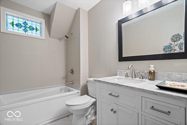 bathroom featuring vanity, bathtub / shower combination, and toilet