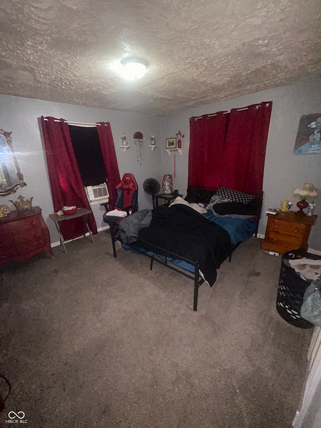 bedroom with carpet floors and a textured ceiling