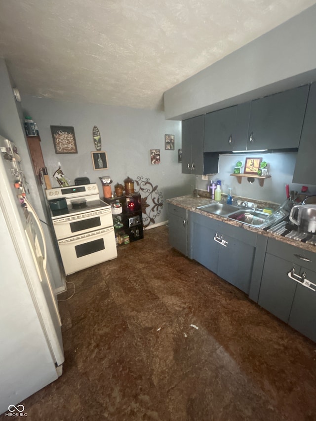 kitchen with a sink, gray cabinets, white appliances, and a textured ceiling