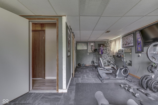 5335 Honey Comb Ln, Indianapolis, IN 46221 - workout area with a paneled ceiling, carpet floors, and baseboards